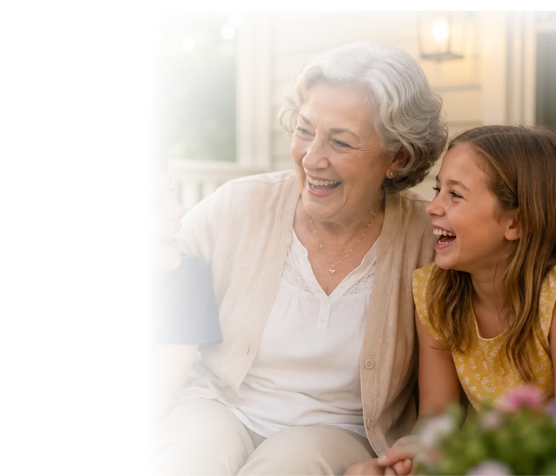 A grandmother laughing with her granddaughter, present and engaged in everyday life